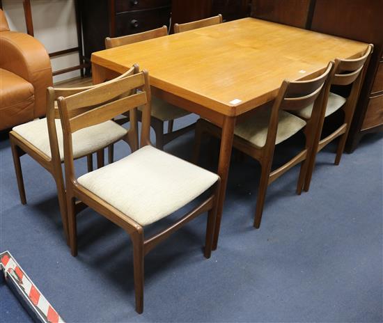 A modern teak dining table and six chairs W.139cm.